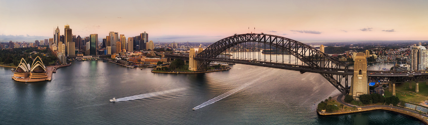 Image of Sydney city, opera house and harbour bridge.