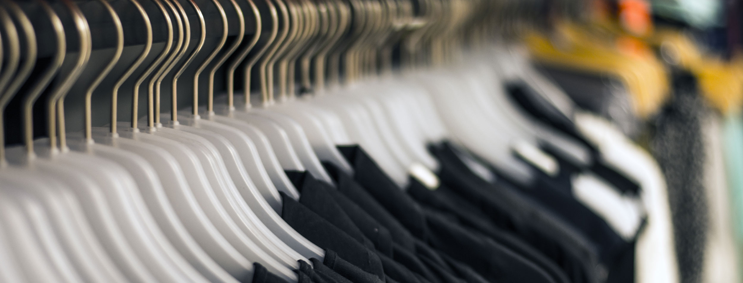 Garments on hangers on clothing rack